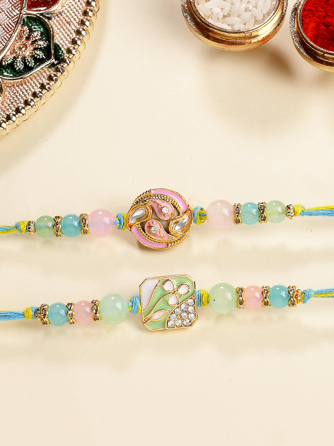 Karatcart Set of 2 Green and Pink Enamel Kundan Rakhi for Brother with Roli & Chawal