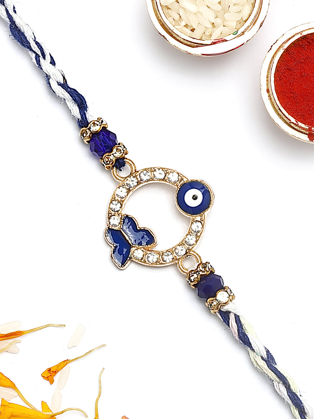 KARATCART Gold Plated Blue American Diamond Butterfly Shape Evil Eye Bhaiya Rakhi with Roli & Chawal