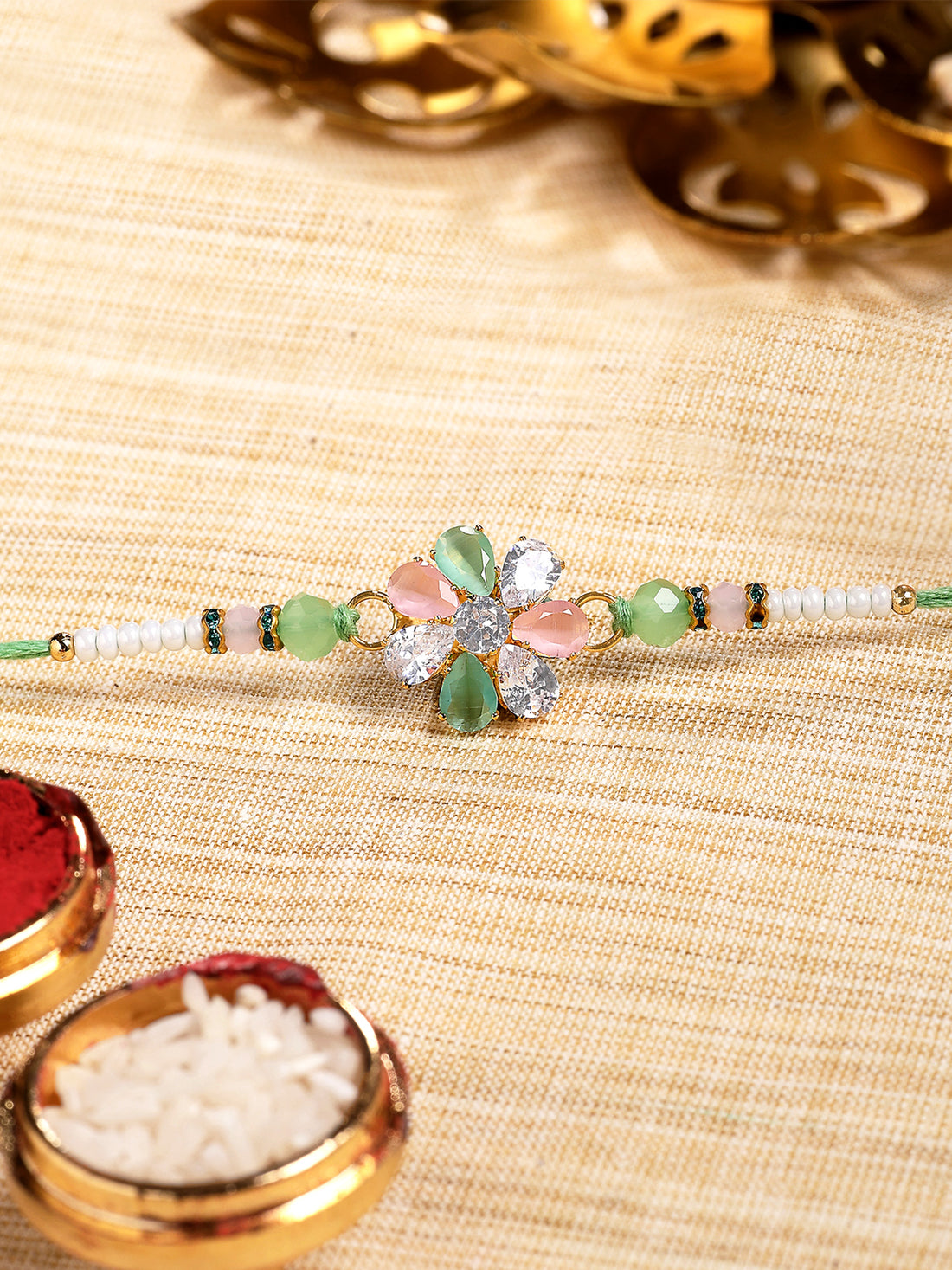 Karatcart Lime Green, Peach and White Rhinestones Floral Bhiya Rakhi with Roli & Chawal