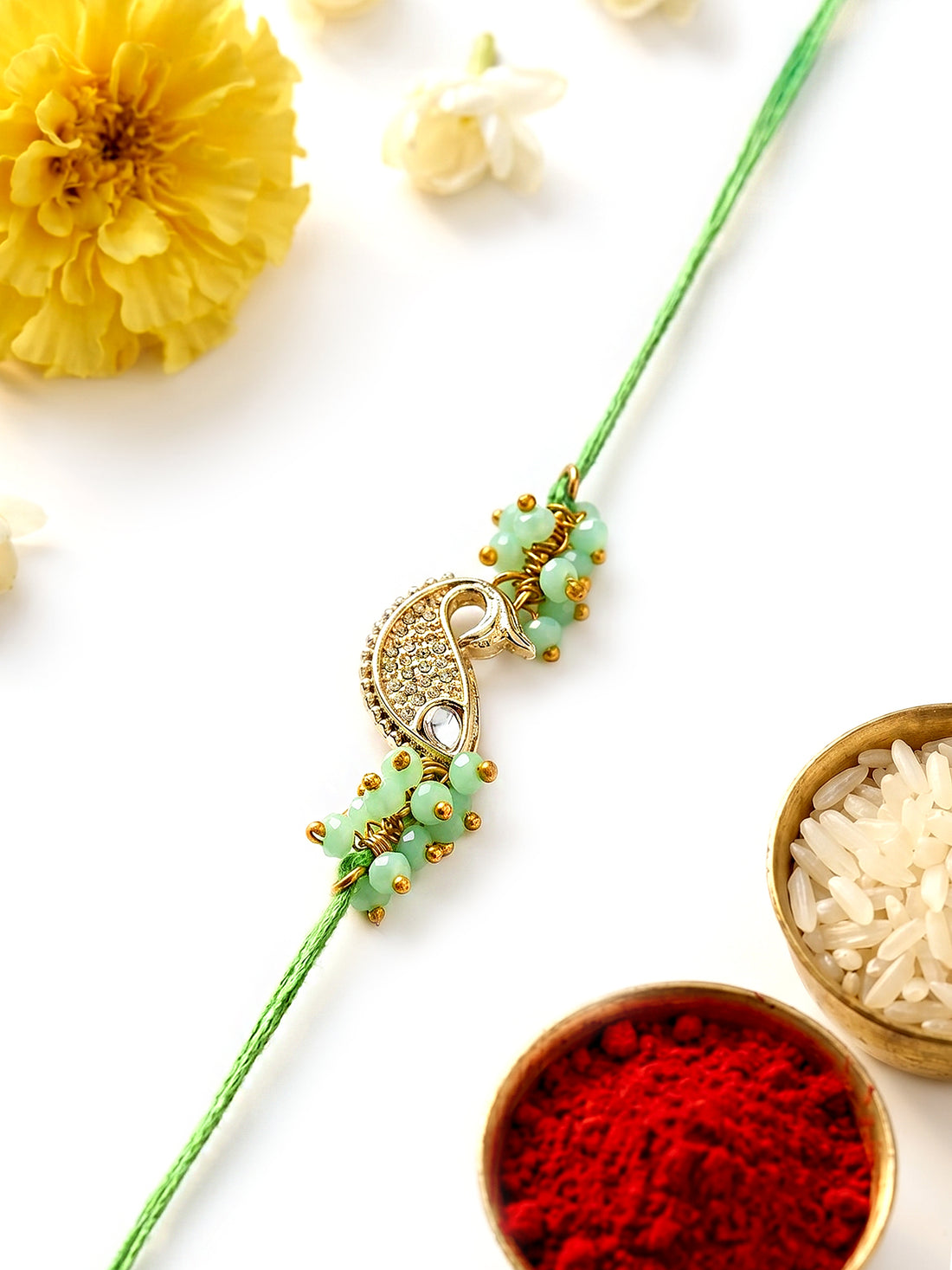 KARATCART Beautiful Light Green Fish Shape Handmade Kundan Rakhi for Brother with Roli & Chawal