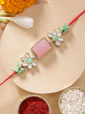 KARATCART Beautiful Pink Carved Stone & Lime Green Crystal Kundan Rakhi for Brother with Roli Chawal