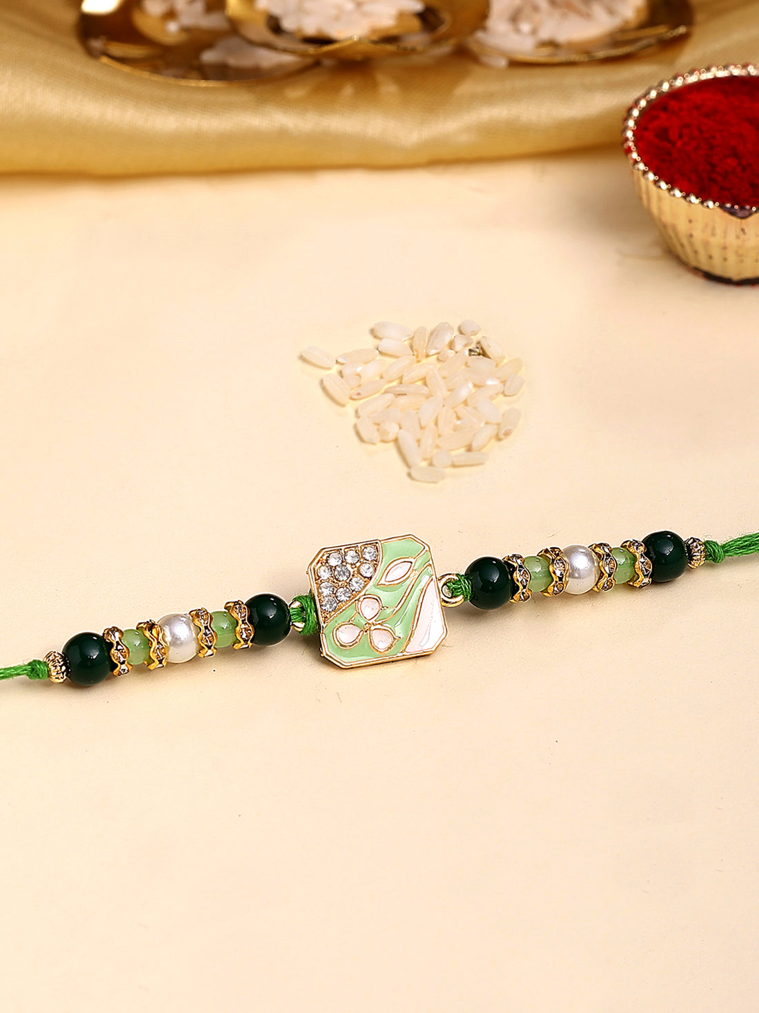 Karatcart Gold Plated Green Beads Kundan Bhiya Rakhi with Roli & Chawal
