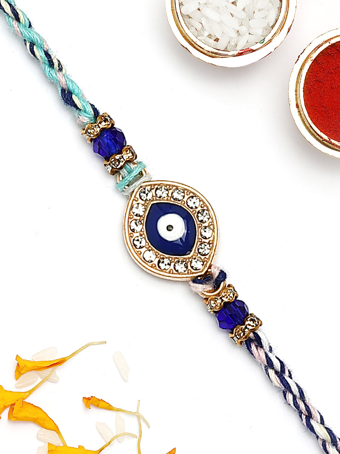 KARATCART Gold Plated Blue Evil Eye and American Diamond Bhaiya Rakhi with Roli & Chawal