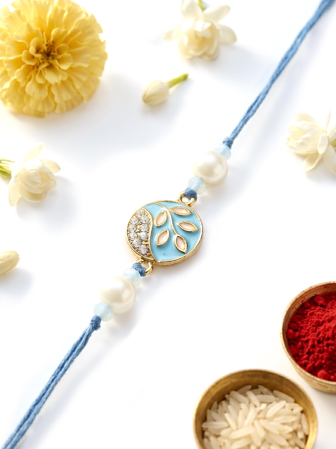 KARATCART Vibrant Light Blue Meena Leaf Design Handmade Kundan Rakhi for Brother with Roli & Chawal