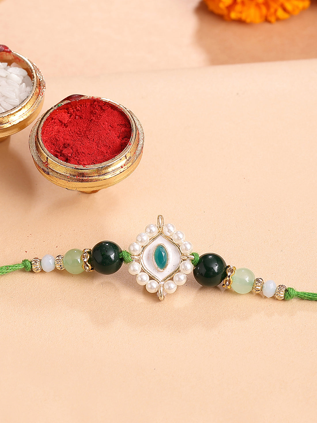 Karatcart Gold Plated Green Evil Eye Kundan Bhiya Rakhi with Roli & Chawal