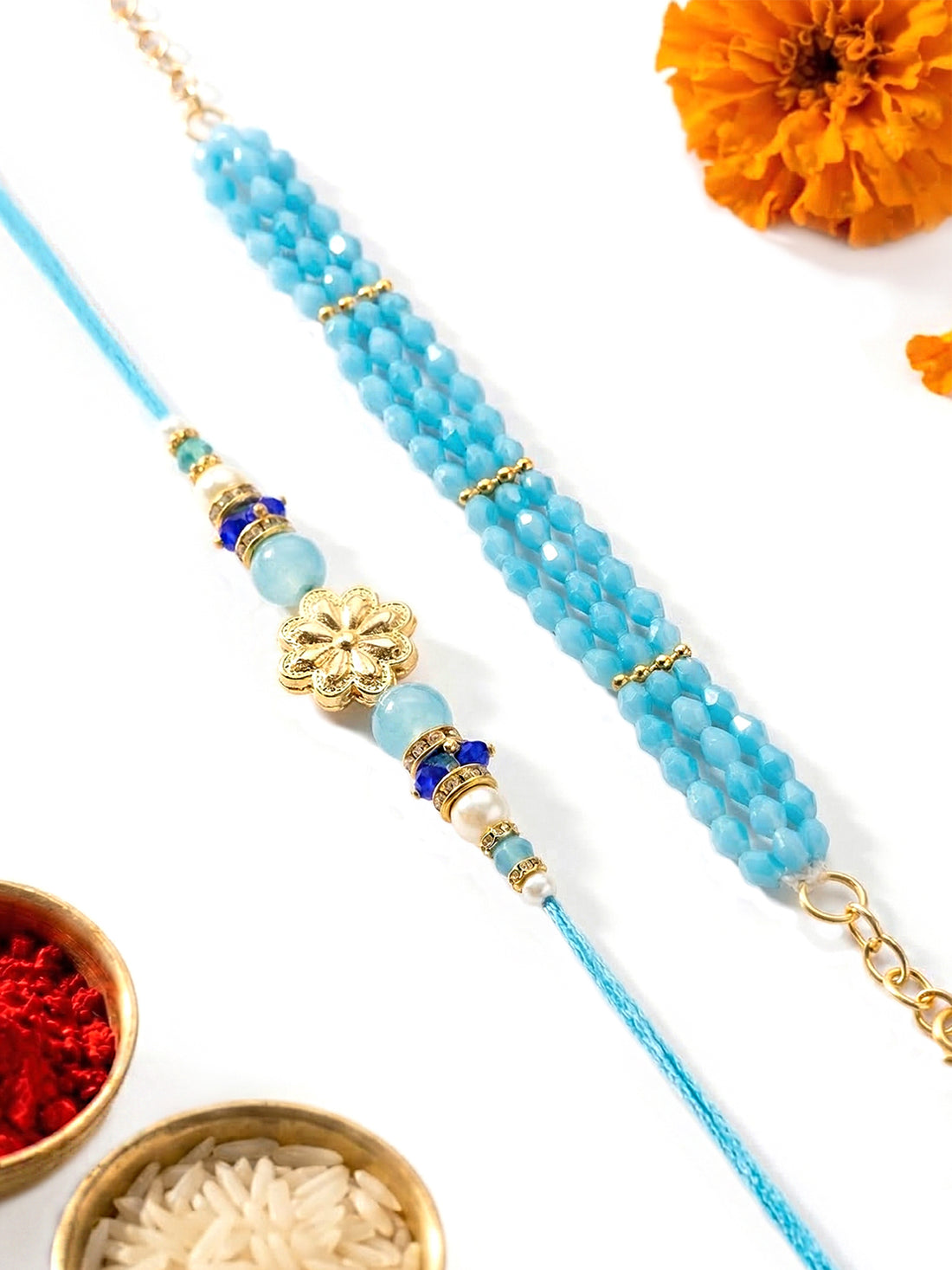 KARATCART Gold Plated Blue Crystal Floral Bhaiya Bhabhi Rakhi with Roli & Chawal