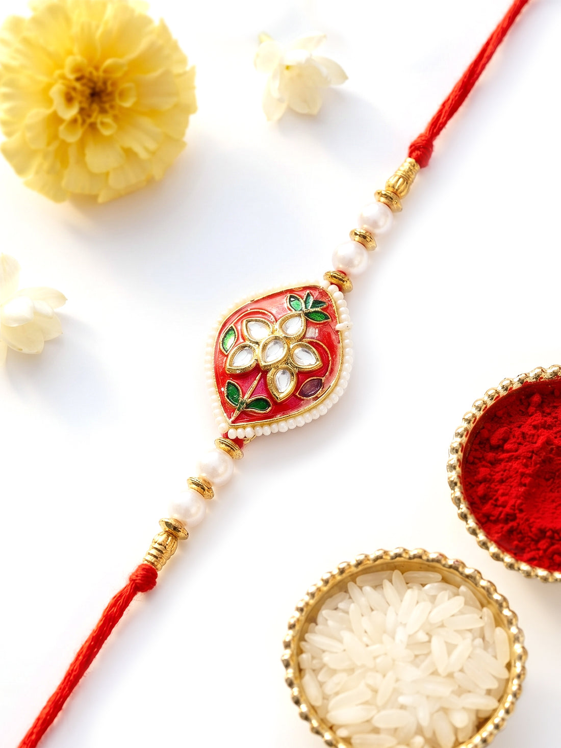KARATCART Vibrant Red Meenakari Floral Design Handmade Kundan Rakhi for Brother with Roli Chawal