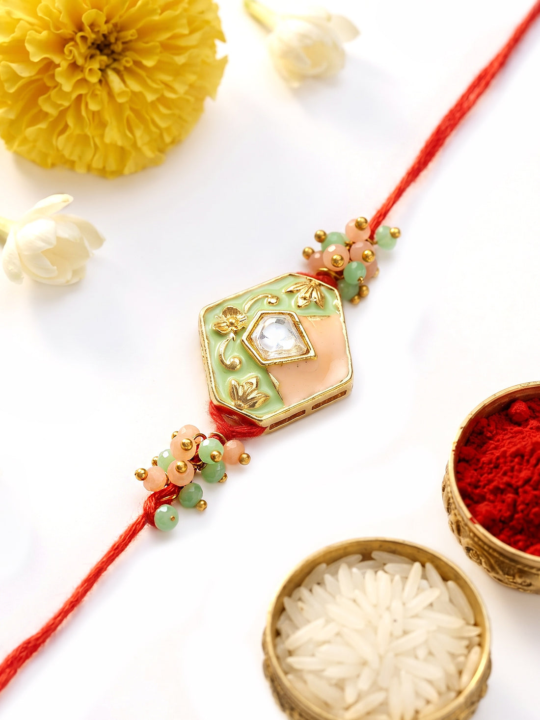KARATCART Beautiful Peach and Lime Green Meena Handmade Kundan Rakhi for Brother with Roli & Chawal