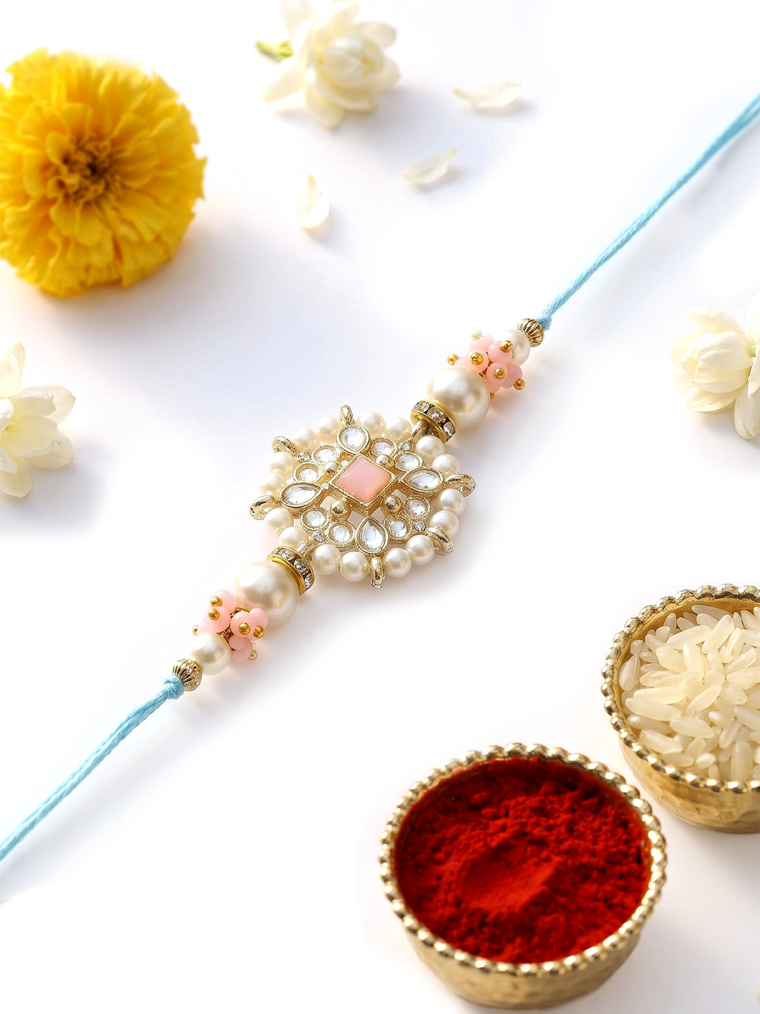 KARATCART Beautiful Floral Design Pink Stone Handmade Kundan Rakhi for Brother with Roli Chawal