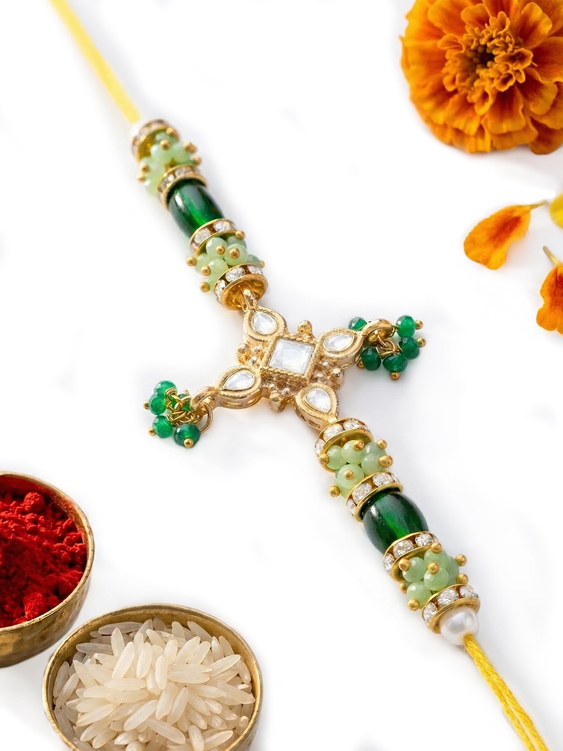 KARATCART Gold Plated Green Crystal Floral Kundan Bhaiya Rakhi with Roli & Chawal
