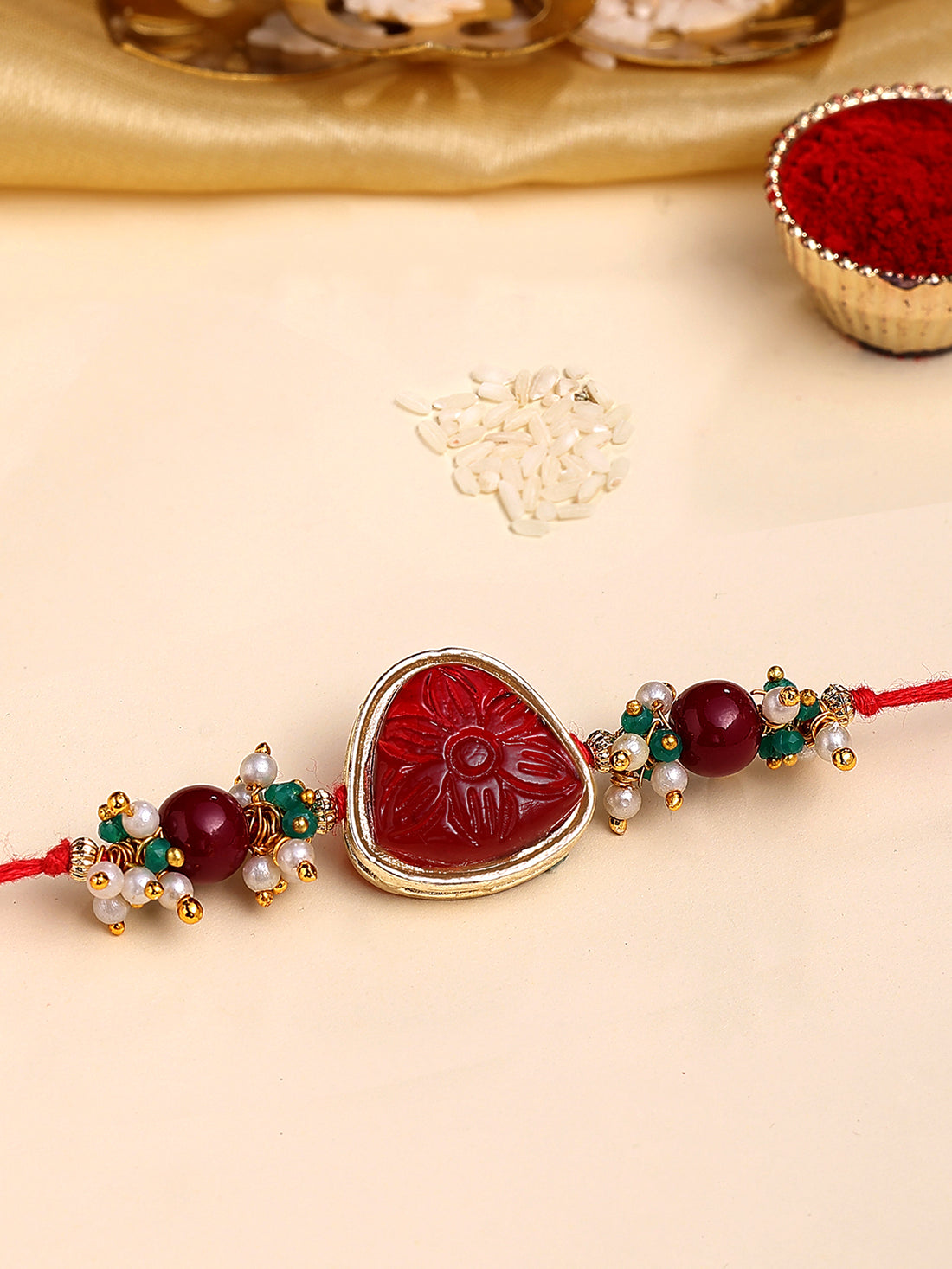 Karatcart Gold Plated Red Carved Stone Kundan Bhiya Rakhi with Roli & Chawal