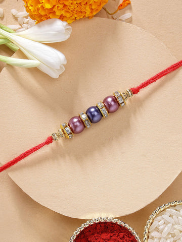 KARATCART Elegant Light Weight Blue and Purple Pearl Handmade Rakhi for Brother with Roli & Chawal