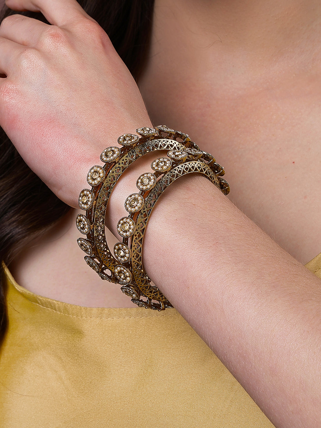Karatcart Set of 2 White Pearl Studded Antique Gold Plated Bangles for Women