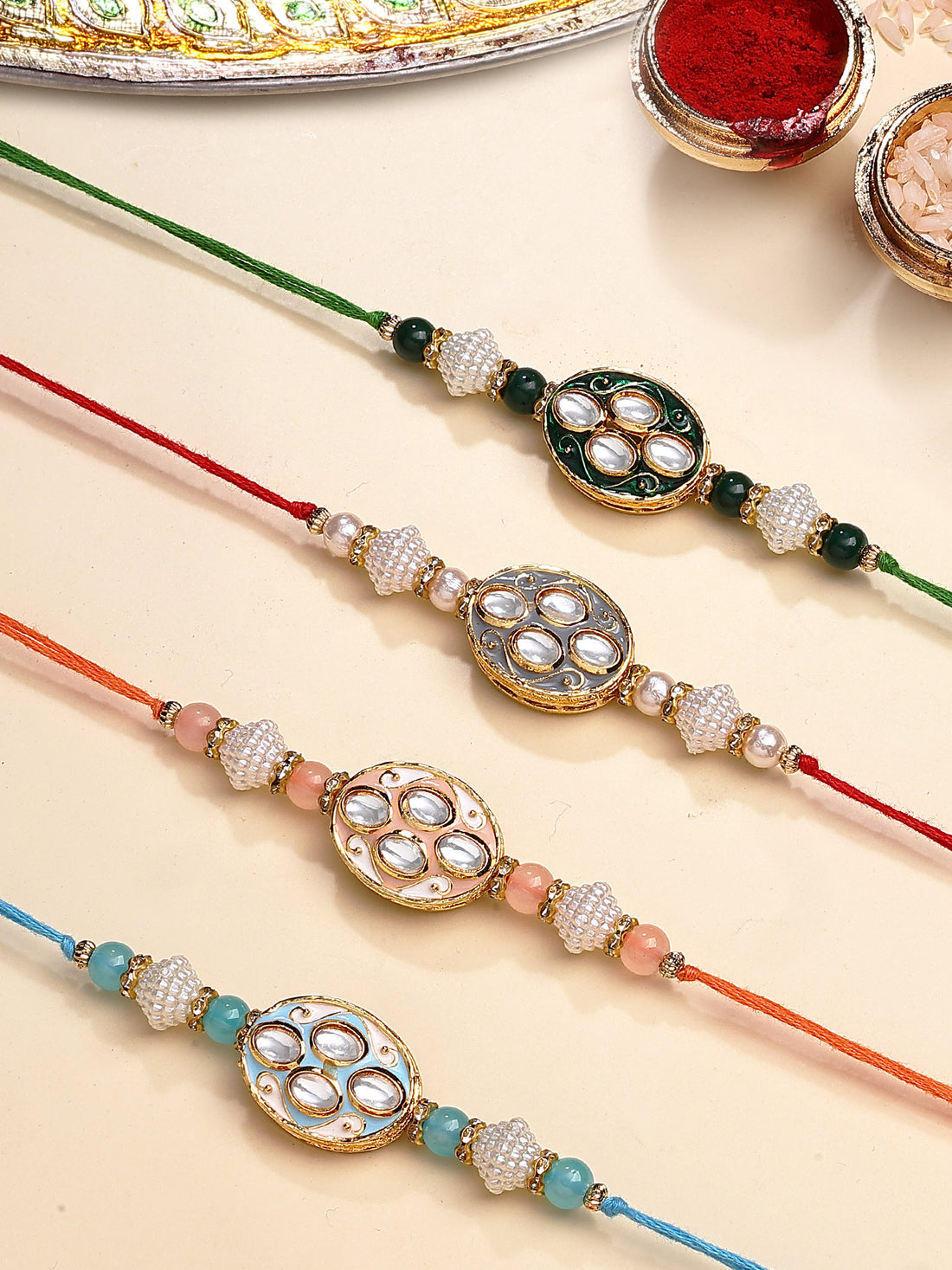 Karatcart Set of 4 Oval Floral Design Enamel Kundan Rakhi for Brother with Roli & Chawal