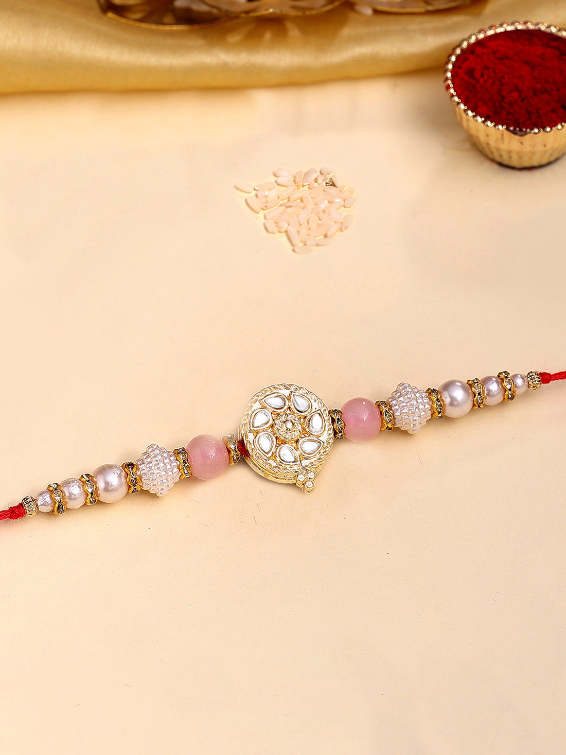 Karatcart Gold Plated Pink and White Beads Kundan Bhiya Rakhi with Roli & Chawal