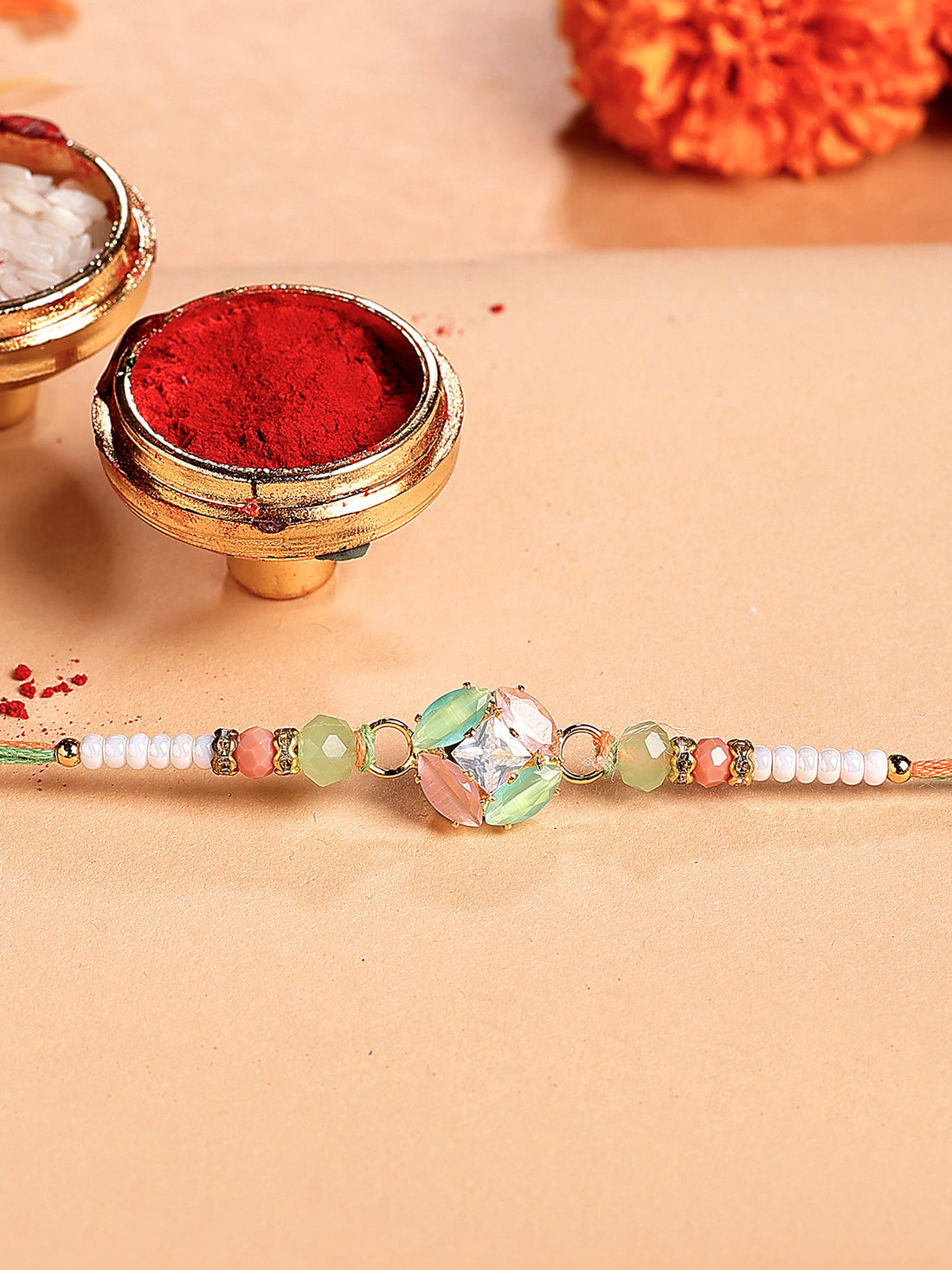 Karatcart Peach and Lime Green Rhinestones Bhiya Rakhi with Roli & Chawal