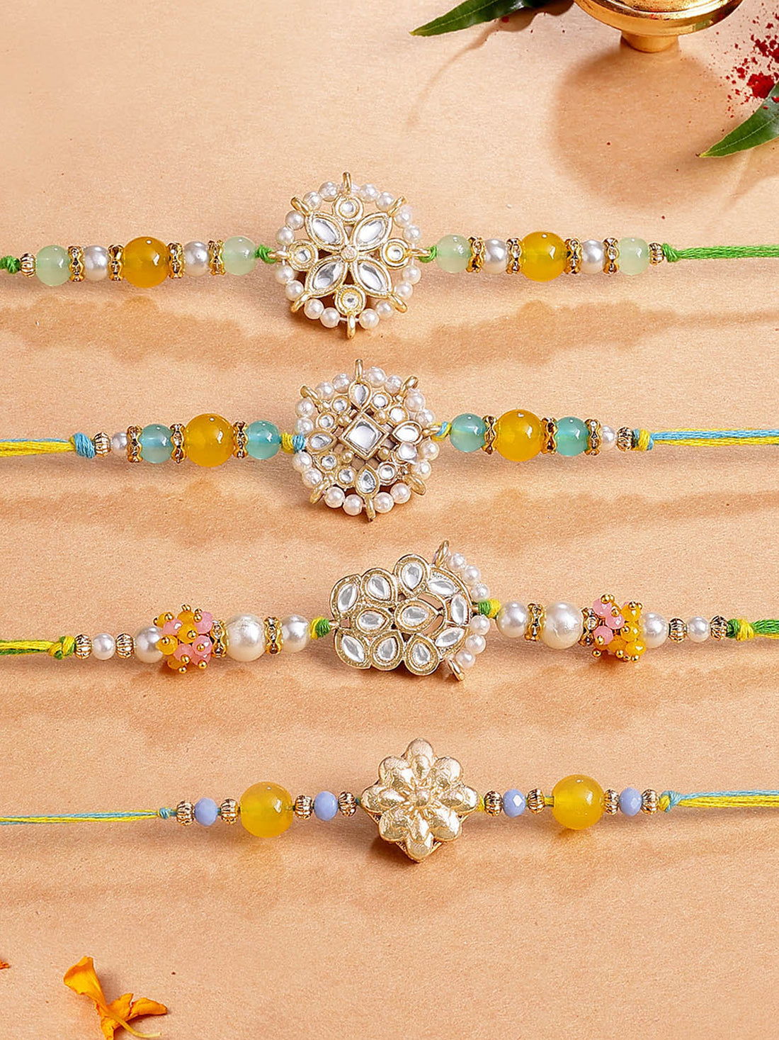 Karatcart Set of 4 Floral Kundan Rakhi for Brother with Roli & Chawal