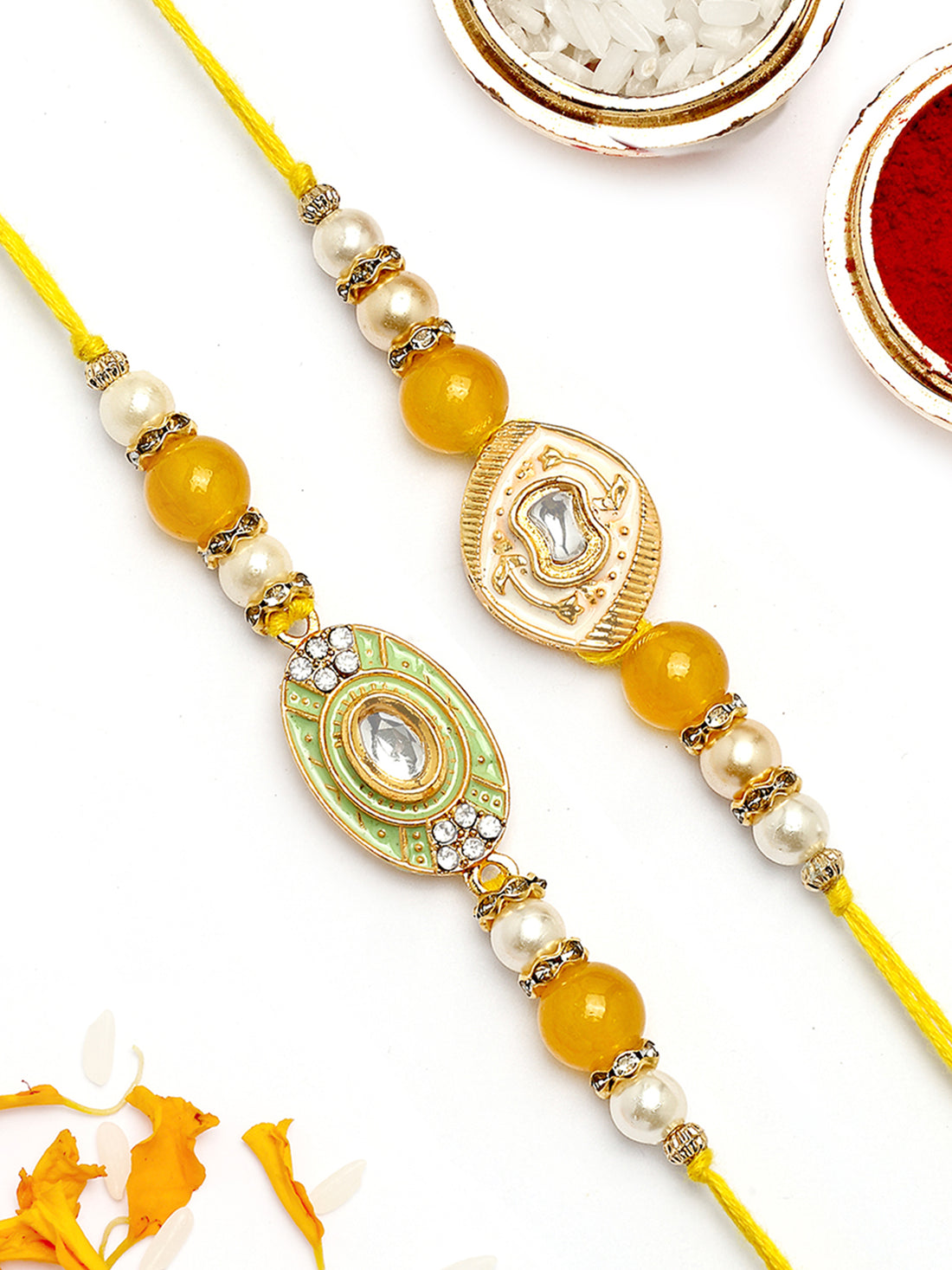 KARATCART Set of 2 White and Light Green Enamel Kundan Rakhi for Brother with Roli & Chawal