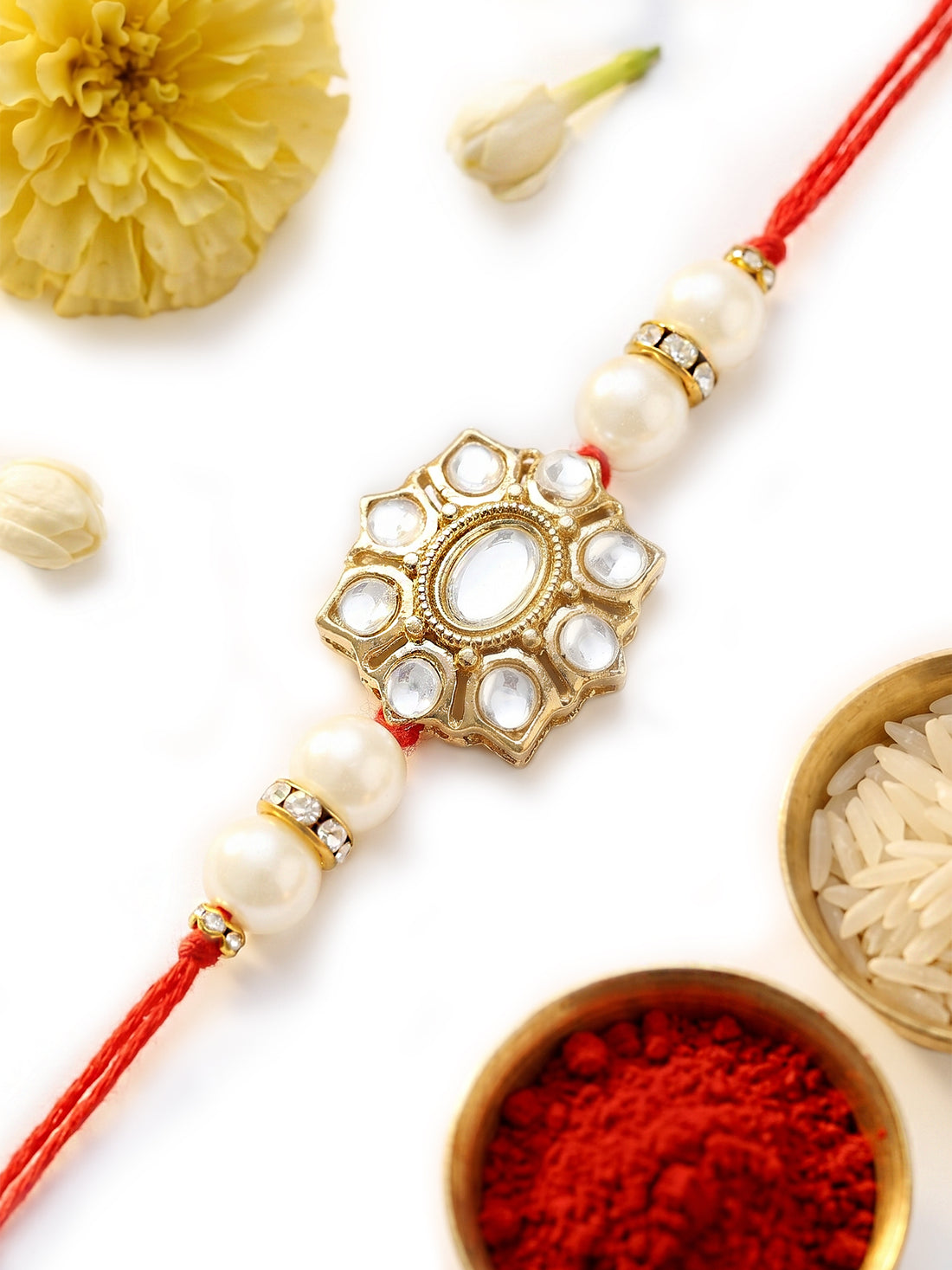 KARATCART Stylish Floral Design Pearl and Kundan Rakhi for Brother with Roli & Chawal