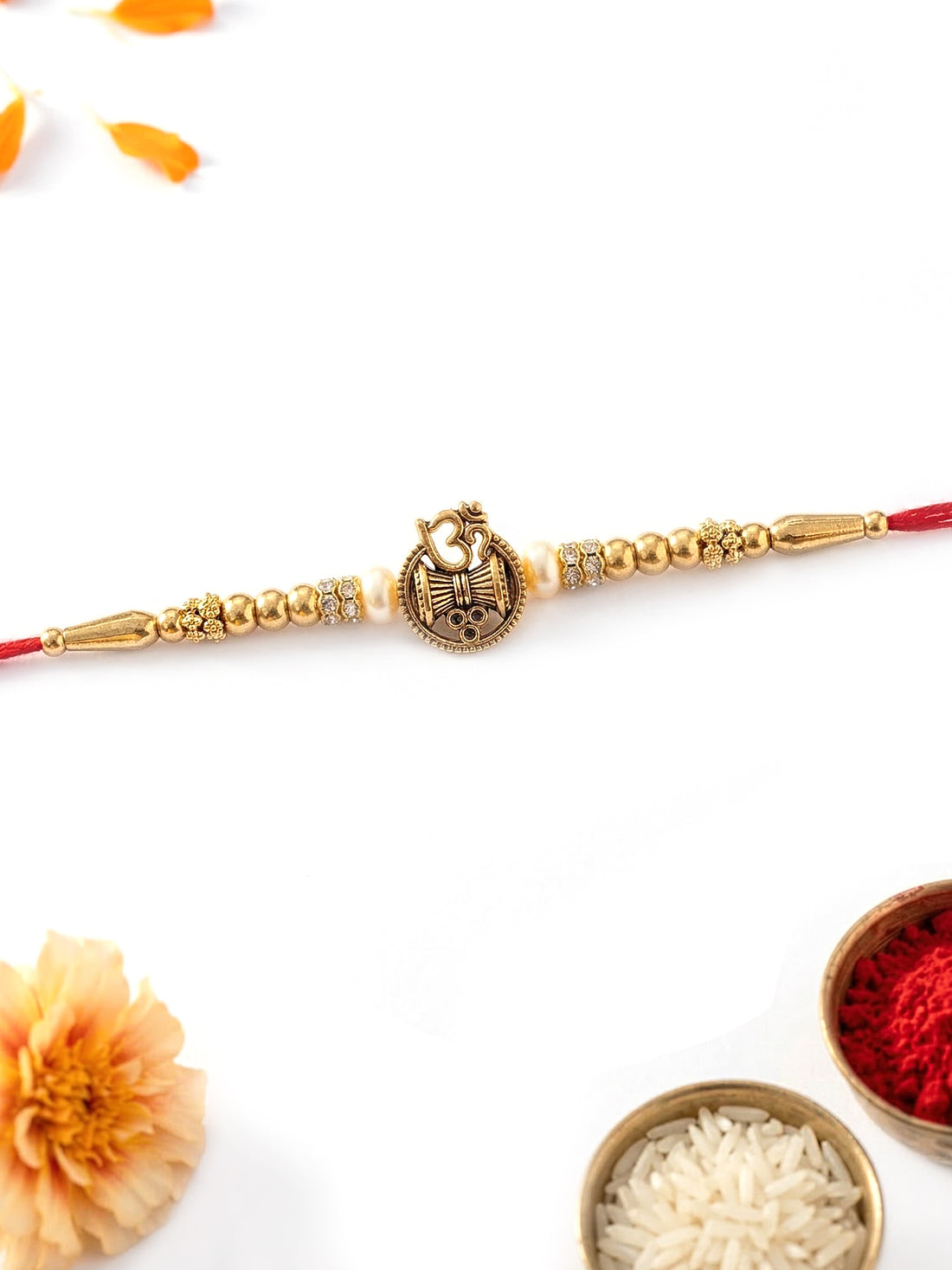 KARATCART Gold Plated Om and Shiv Damru Rakhi for Bhaiya with Roli & Chawal
