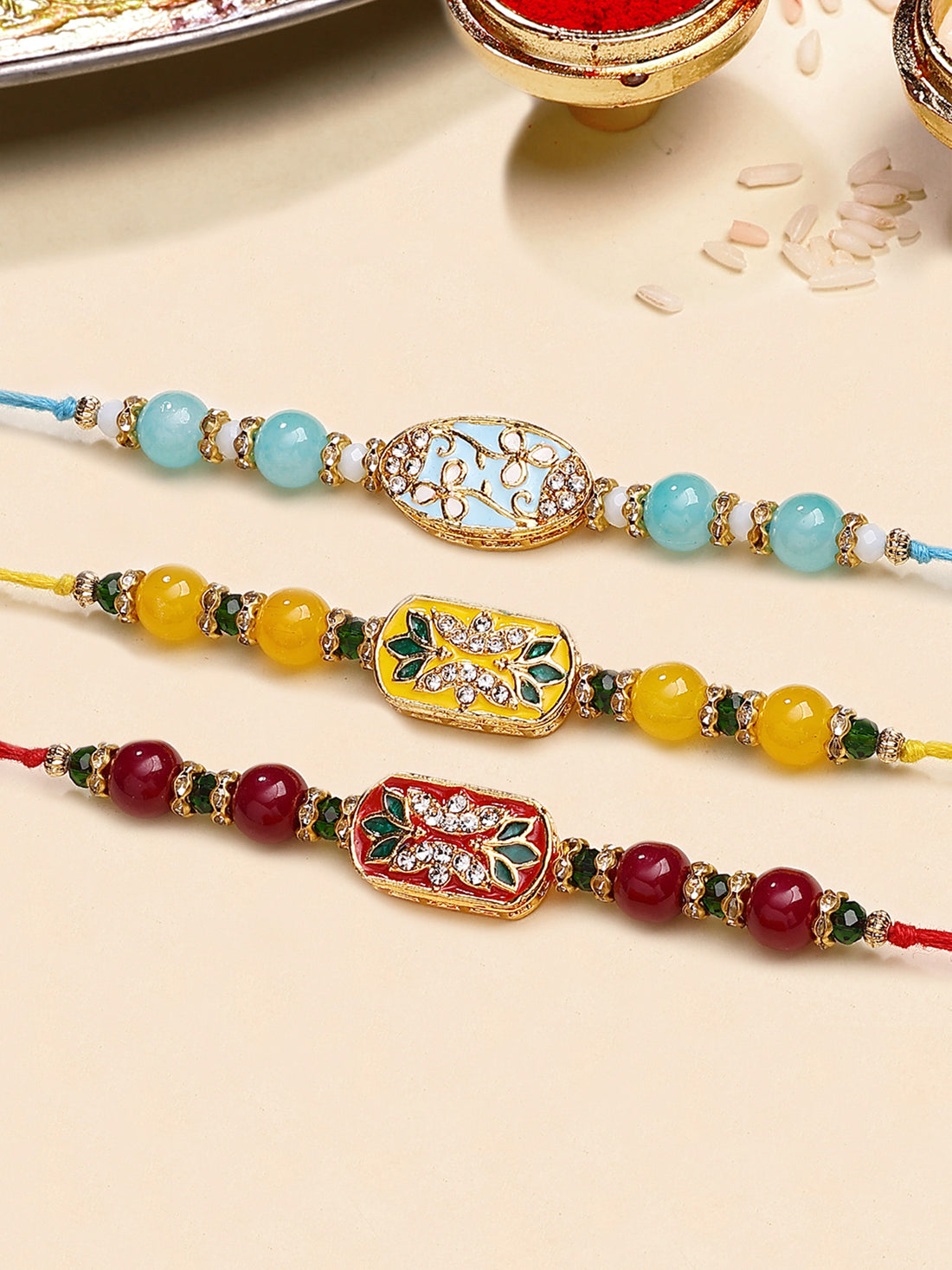 Karatcart Set of 3 Red, Blue and Yellow Enamel Floral Design Rakhi for Brother with Roli & Chawal