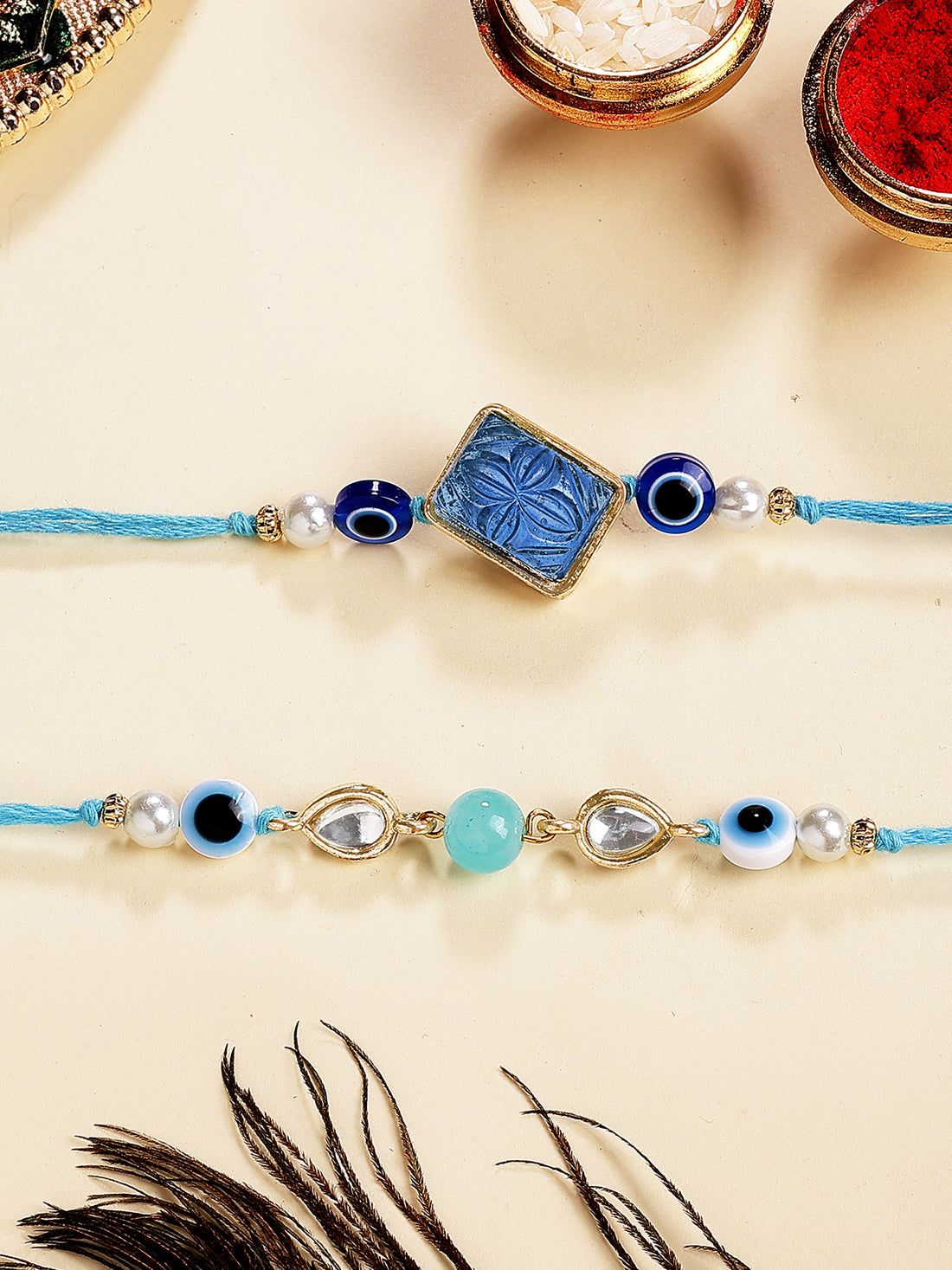 Karatcart Set of 2 Blue Carved Stone Evil Eye Kundan Rakhi for Brother with Roli & Chawal