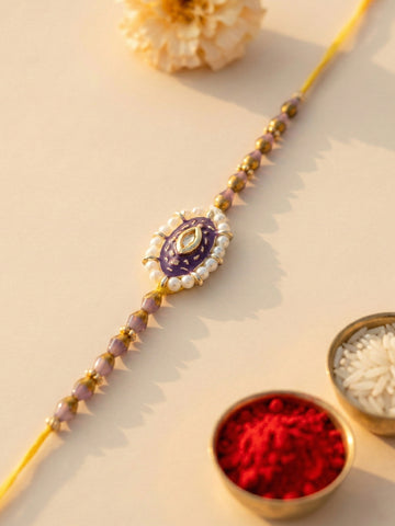 KARATCART Gold Plated Purple Meena Oval Kundan Bhaiya Rakhi with Roli & Chawal