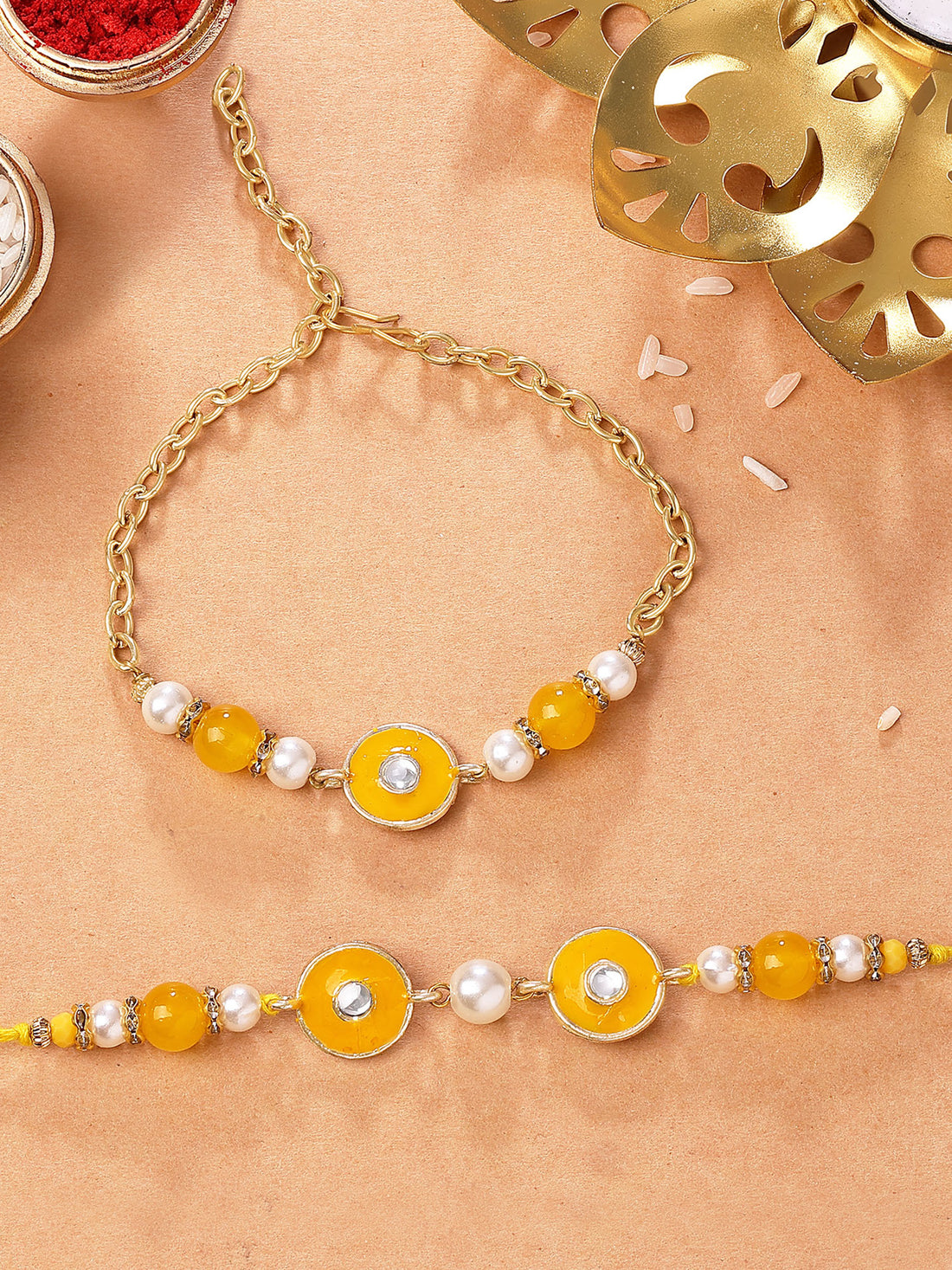 Karatcart Gold Plated Yellow Meena and Pearl Kundan Bhiya Bhabhi Rakhi with Roli & Chawal