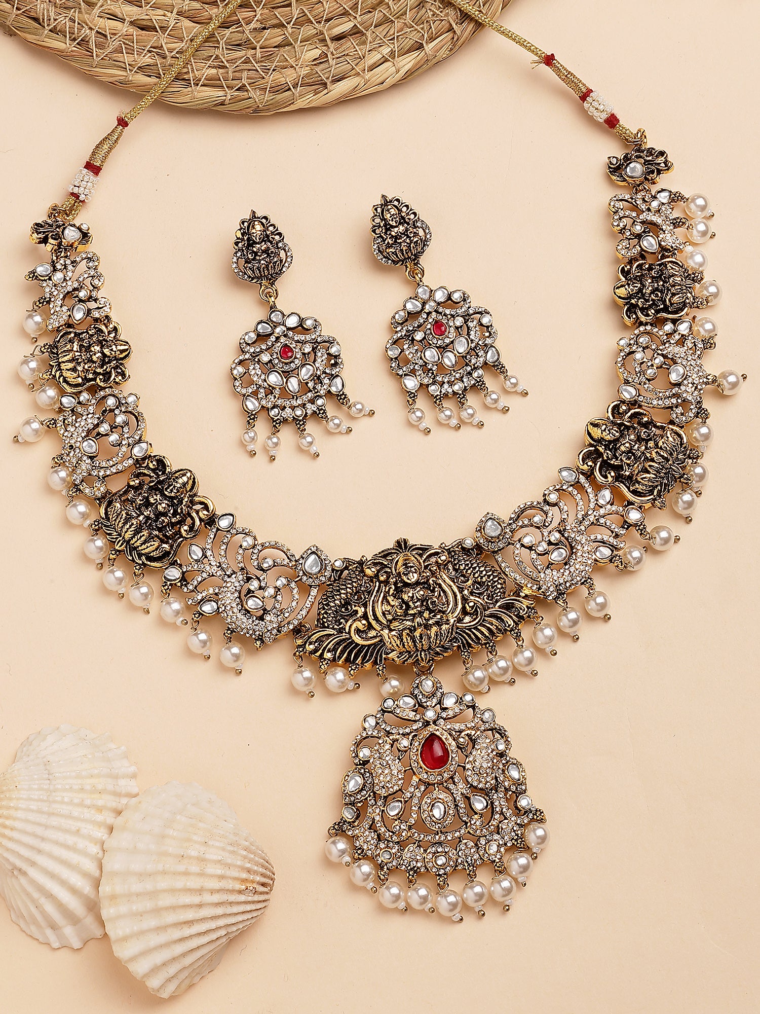 KARATCART Black Gold Plated Red Stone Laxmi Mata Temple Jewellery Set for Women