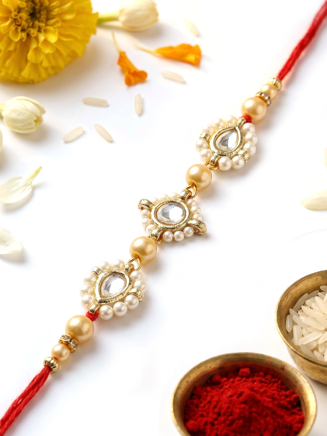 KARATCART Beautiful Golden Pearls and Kundan Handmade Rakhi for Brother with Roli & Chawal