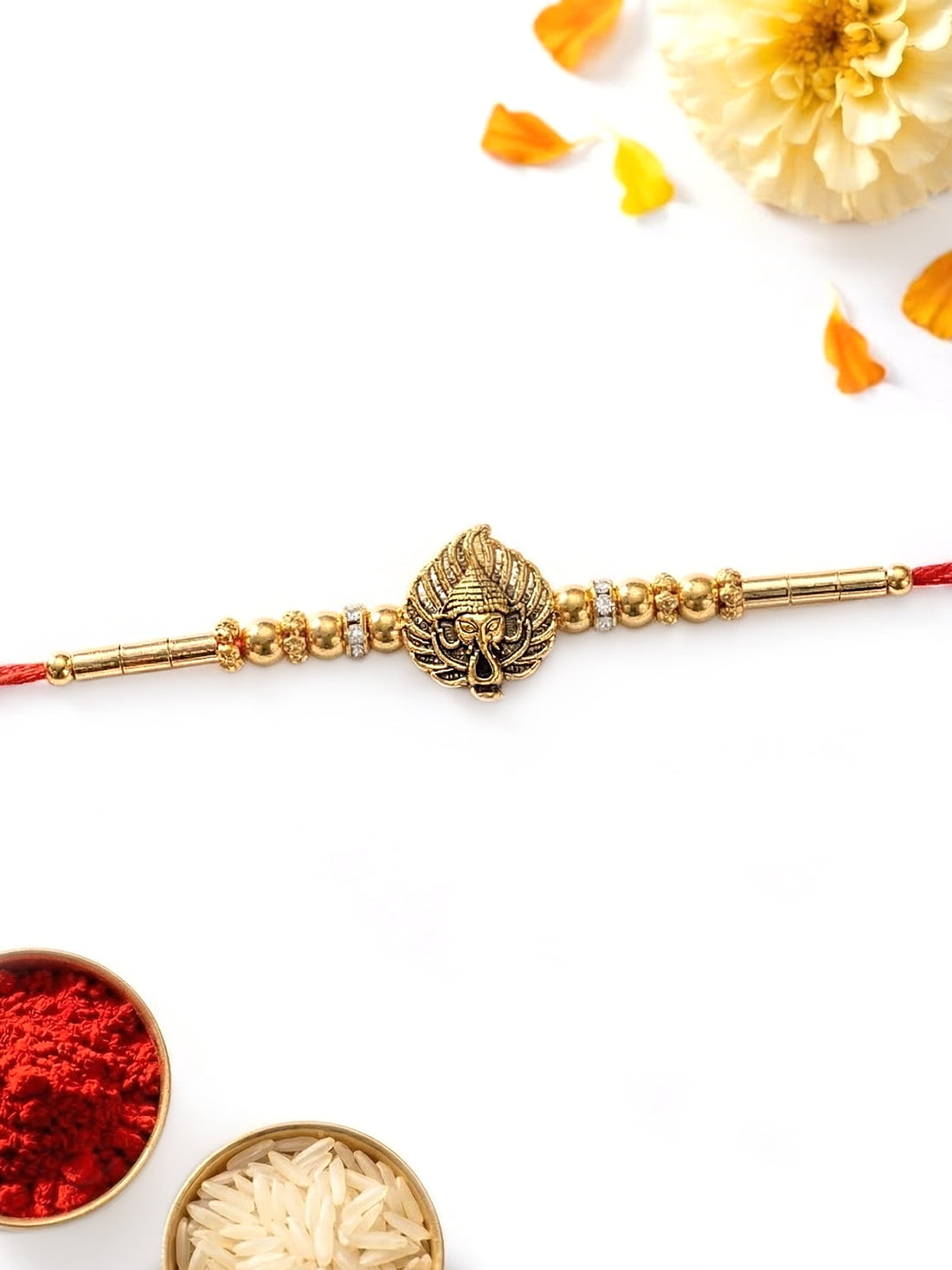 KARATCART Gold Plated Ganpati Face Paan Leaf Designer Bhaiya Rakhi with Roli & Chawal
