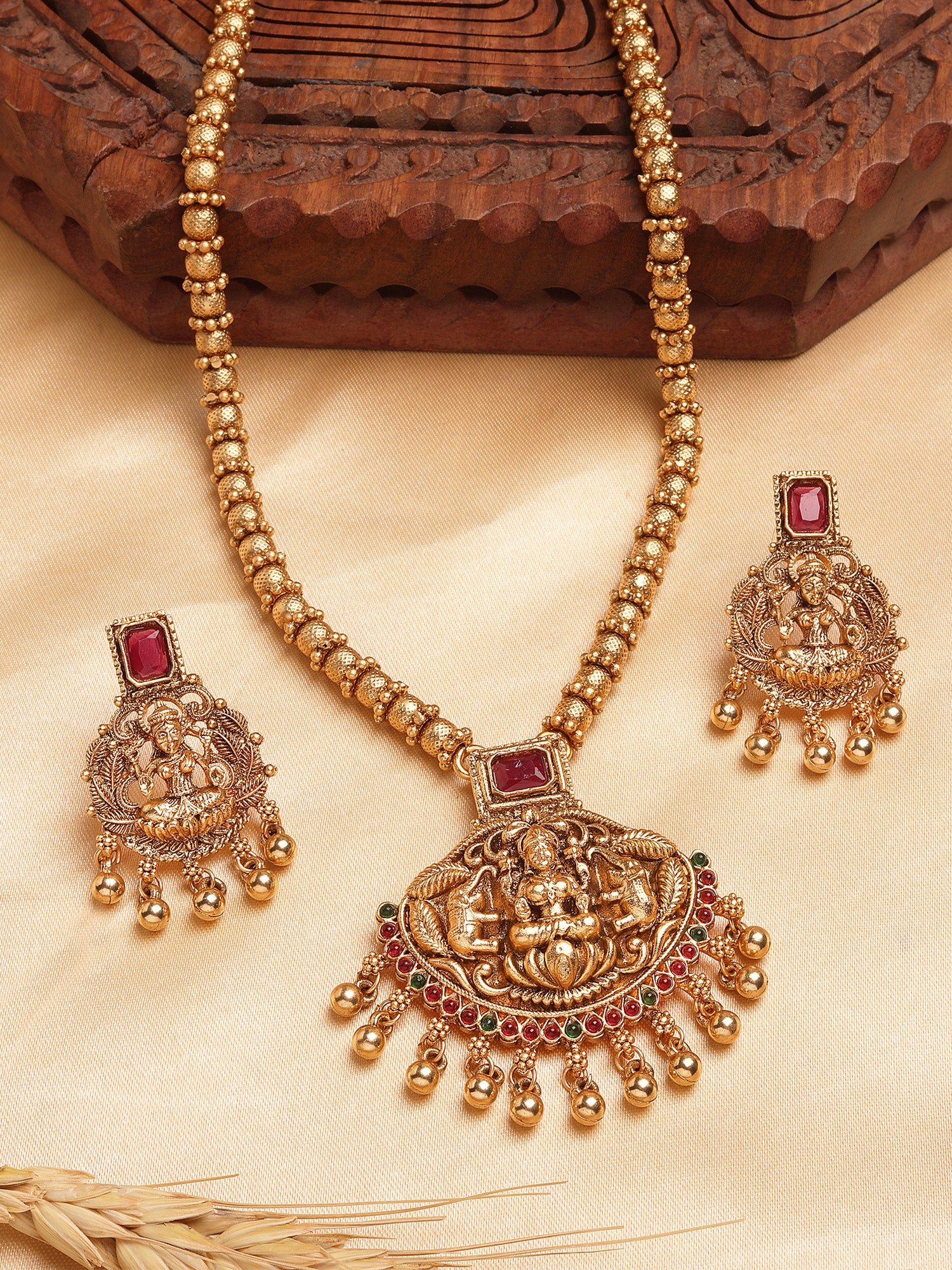 Karatcart Red Stone Gold Plated Laxmi Mata Engraved Long Temple Necklace Set for Women