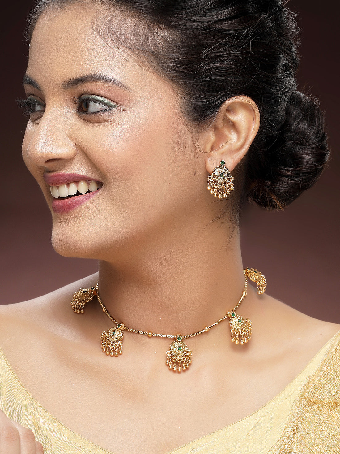 KARATCART Traditional Gold-Plated Green Stone Round Chakra Temple Jewellery Set for Women