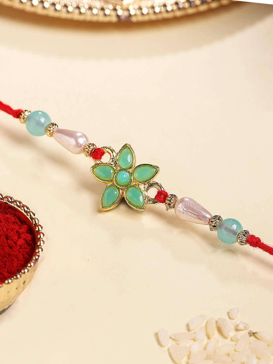 Karatcart Gold Plated Light Blue Floral Kundan Bhiya Rakhi with Roli & Chawal