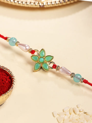 KARATCART Gold Plated Light Blue Floral Kundan Bhaiya Rakhi with Roli & Chawal