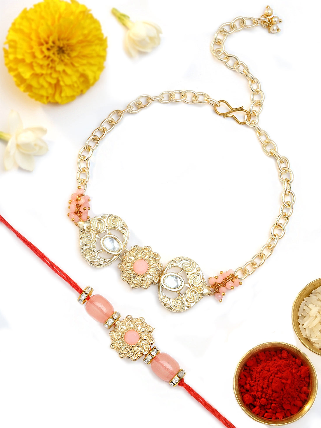 KARATCART Pink Stone Heart Shape Handmade Kundan Bhaiya Bhabhi Rakhi with Roli & Chawal