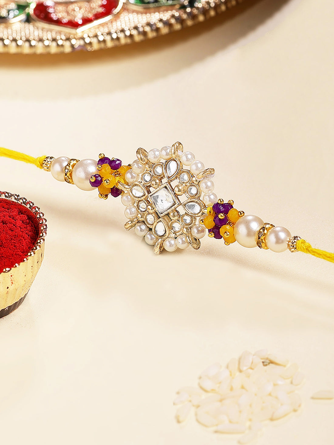 Karatcart Gold Plated Yellow and Blue Floral Kundan Bhiya Rakhi with Roli & Chawal