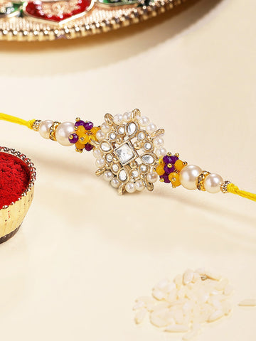 KARATCART Gold Plated Yellow and Blue Floral Kundan Bhaiya Rakhi with Roli & Chawal
