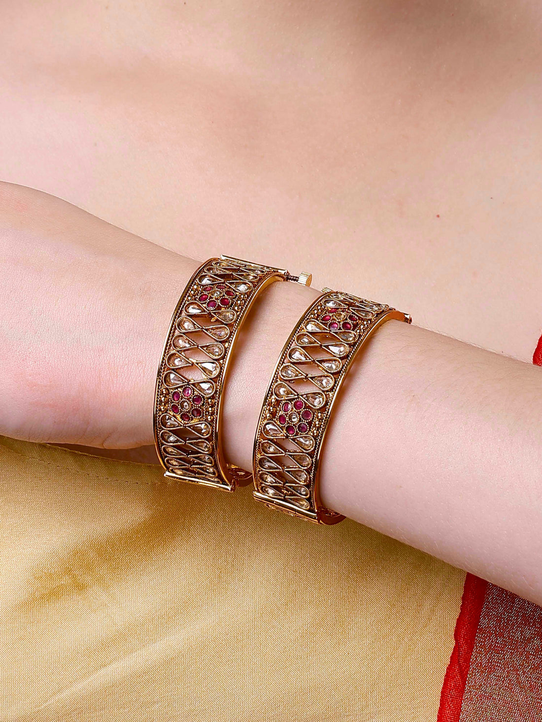 Karatcart Set of 2 Antique Gold Plated Drop Shape Floral Design Bangles for Women