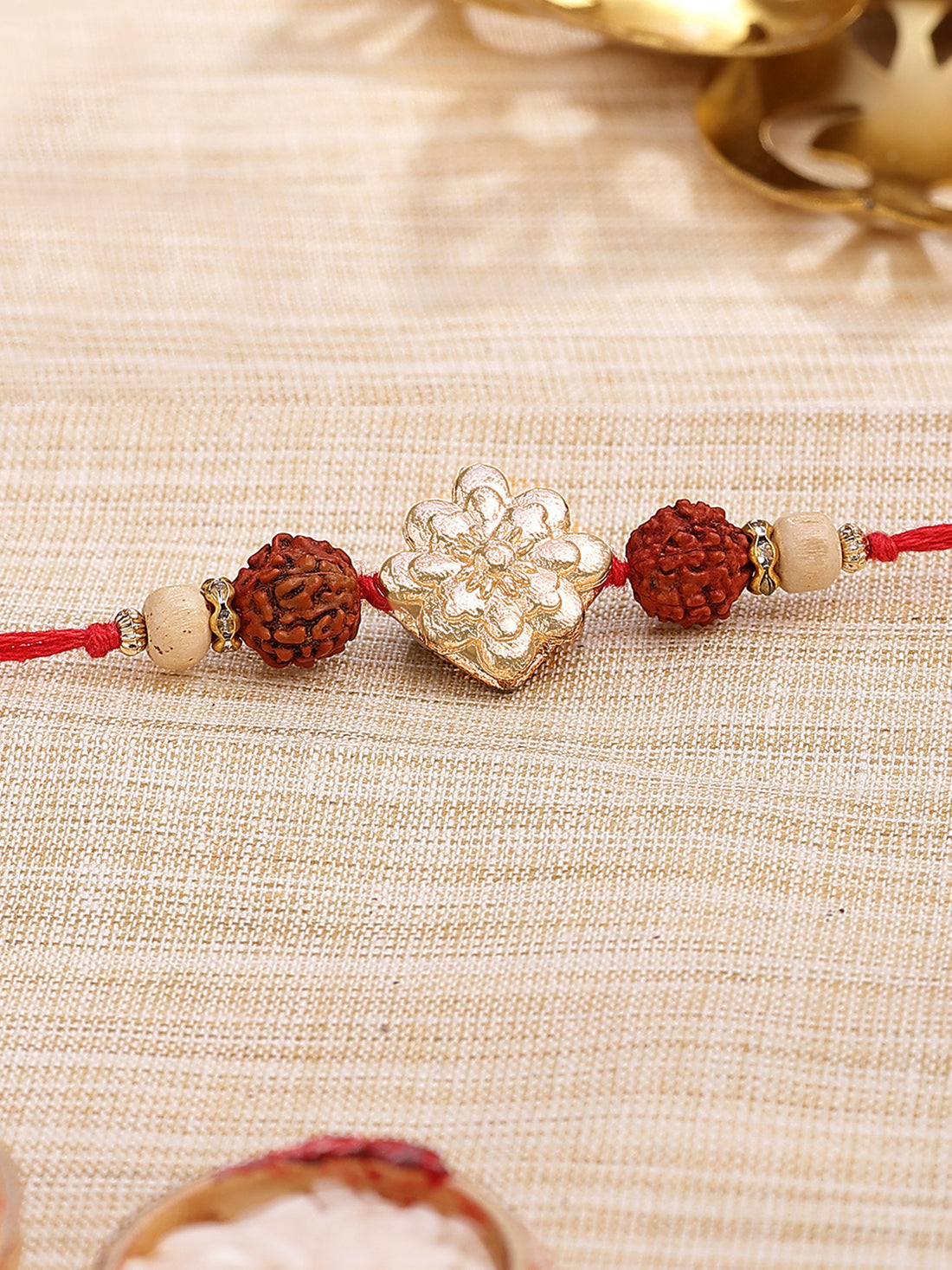 Karatcart Gold Plated Floral Kundan Rudraksha Studded Bhiya Rakhi with Roli & Chawal