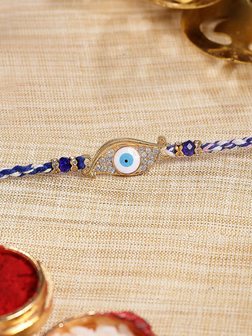 KARATCART Gold Plated Blue American Diamond Eye Shape Evil Eye Bhaiya Rakhi with Roli & Chawal