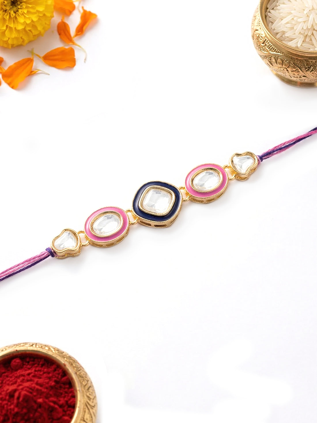 KARATCART Gold Plated Pink and Blue Meena Kundan Bhaiya Rakhi with Roli & Chawal