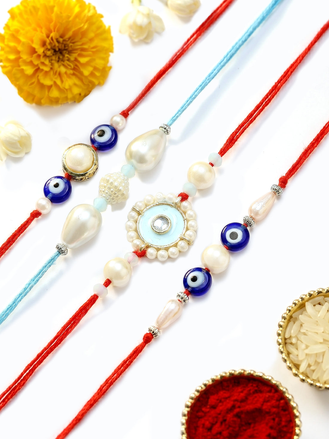 KARATCART Set of 4 Pearl Handmade Meenakari Evil Eye Kundan Rakhis for Brother with Roli and Chawal