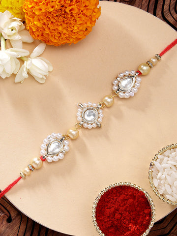 KARATCART Beautiful Golden Pearls and Kundan Handmade Rakhi for Brother with Roli & Chawal