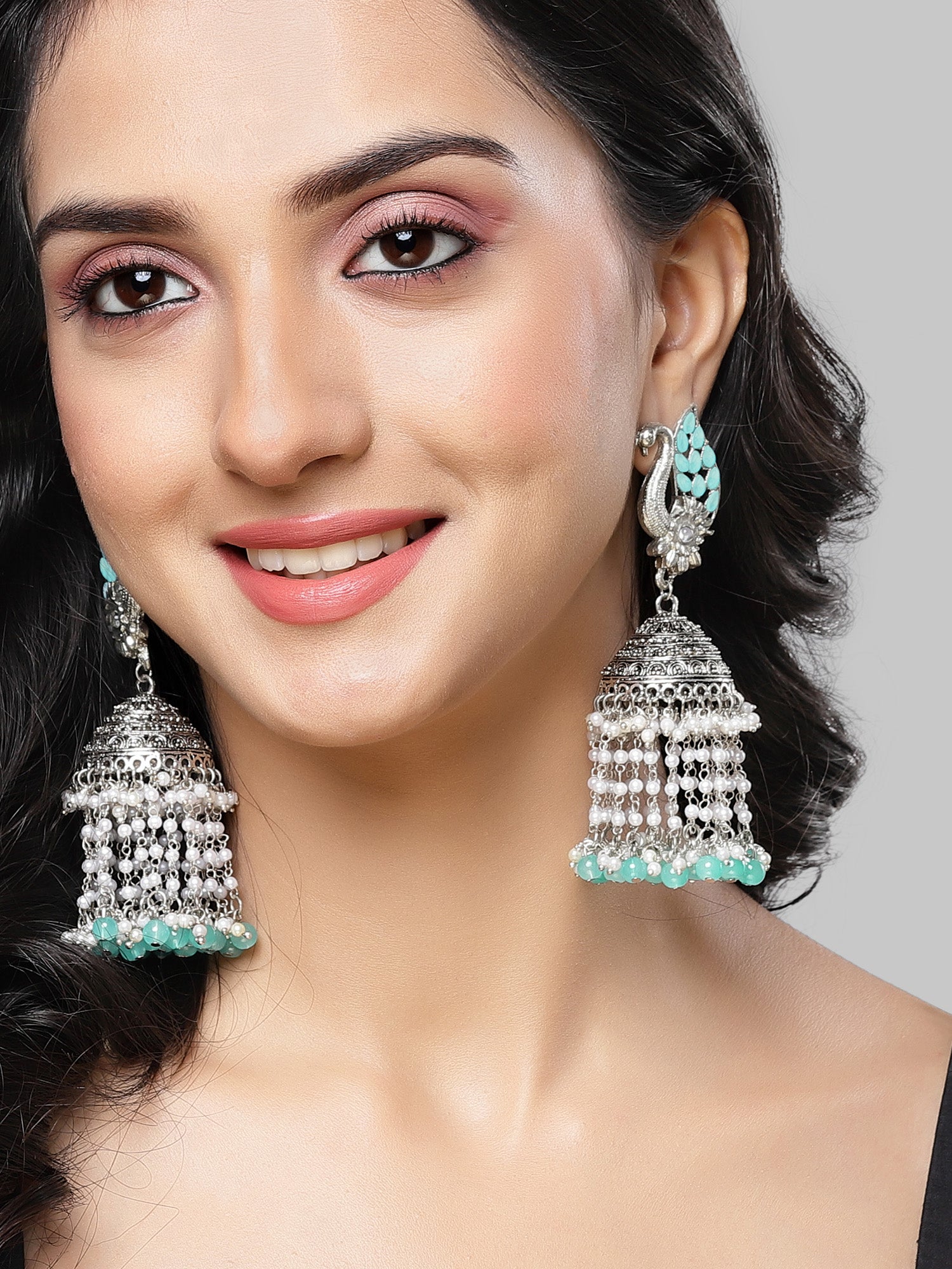 Karatcart Oxidised Silver Light Blue Kundan Peacock Jhumki Earrings for Women - Image 1