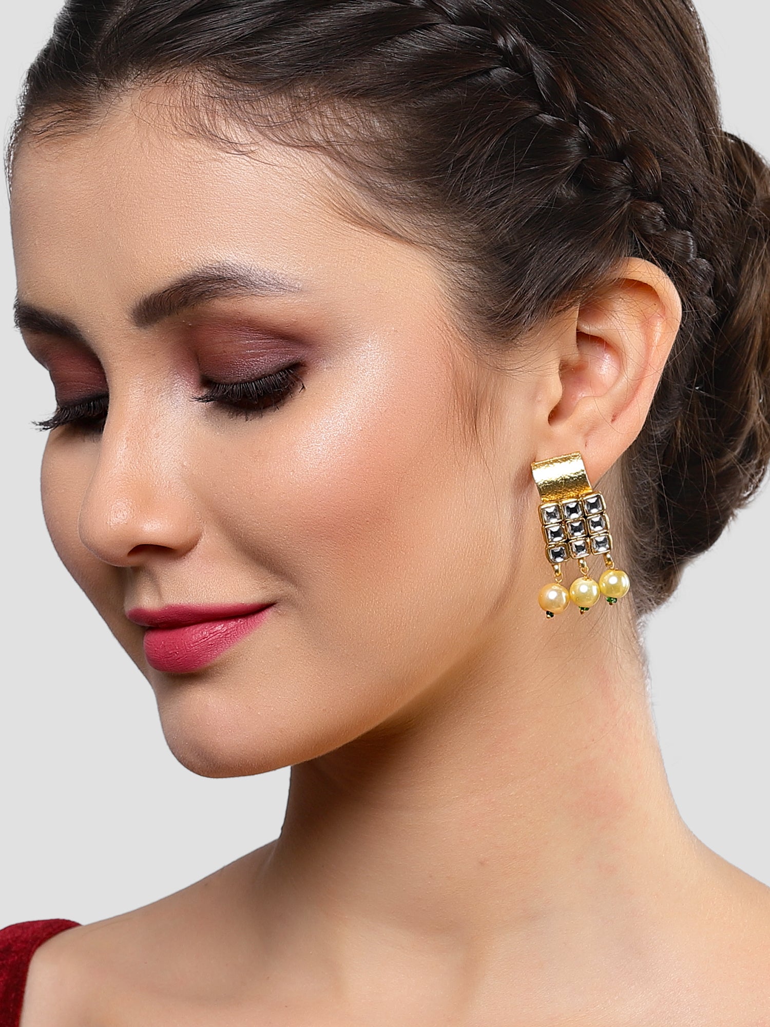 Karatcart Gold Plated White Kundan and Golden Pearl Stud Earrings for Women - Image 1