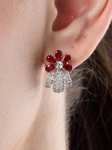 Karatcart Silver Plated Red Stones Floral Design AD Stud Earrings for Women