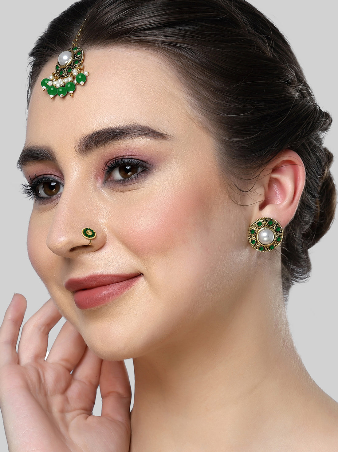 Karatcart Gold Plated Green Stone and Beads Studded Earrings with Maangtikka and Nath Combo