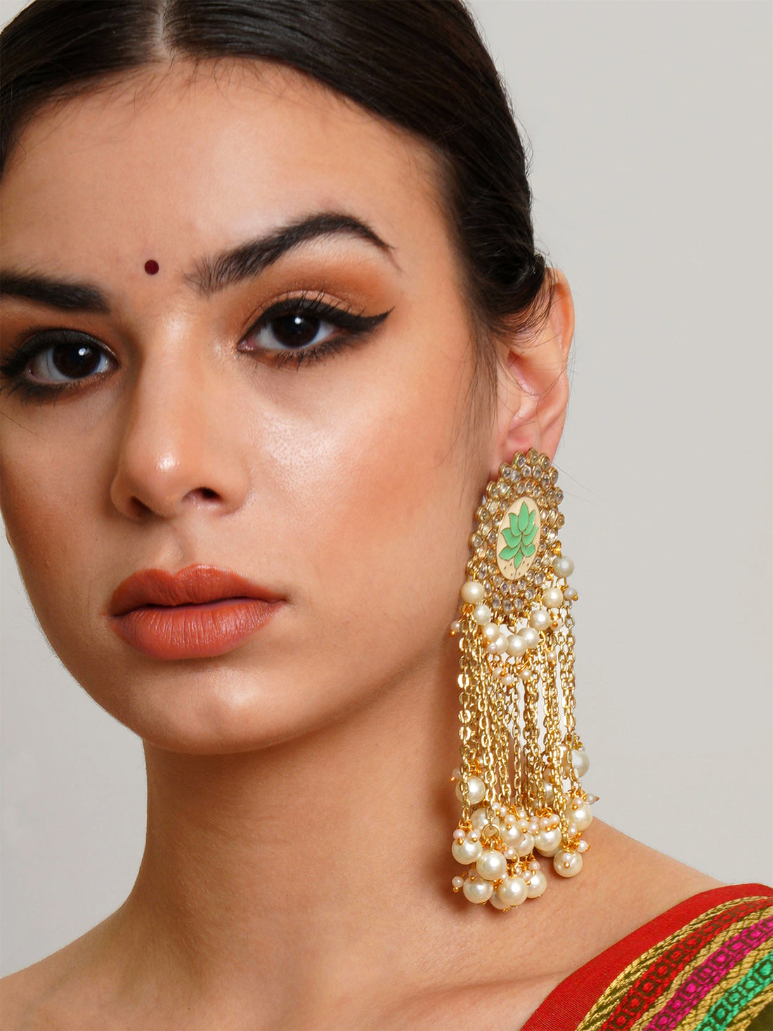 Karatcart Gold Plated Light Green Meena Pearl Beads Kundan Tassel Earrings for Women