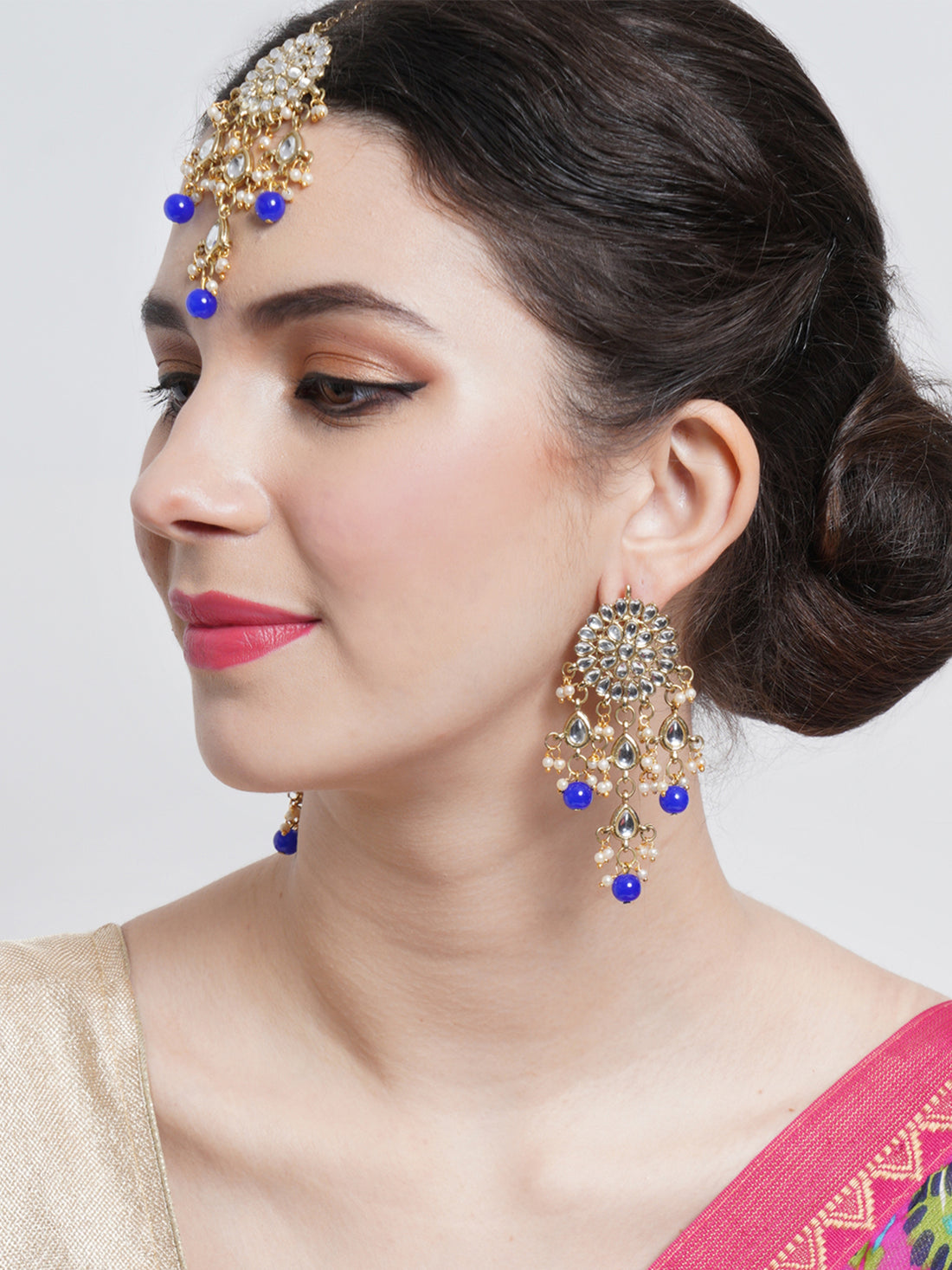 Gold Plated Embellished Blue Kundan Tassel Earrings with Maangtikka